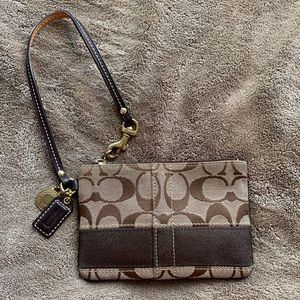 Coach brown signature logo wristlet. Gently used.